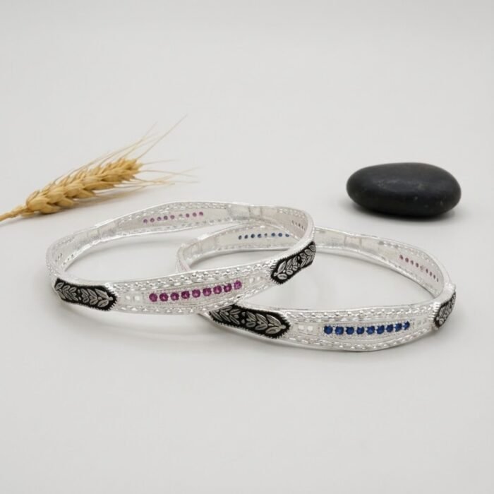 Stylish full micro silver bangles with pink and blue stone detailing and oxidised floral motifs – premium women’s silver bangles for B2B retailers