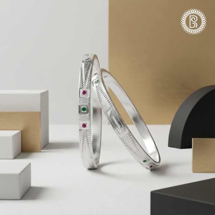 CNC silver ladies bangle with geometric engraved design and stone accents